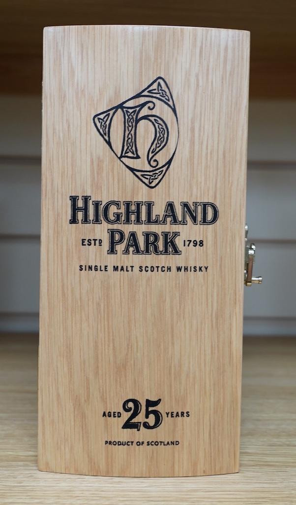 A wood cased bottle of Highland Park 25 year old whisky. Condition - good